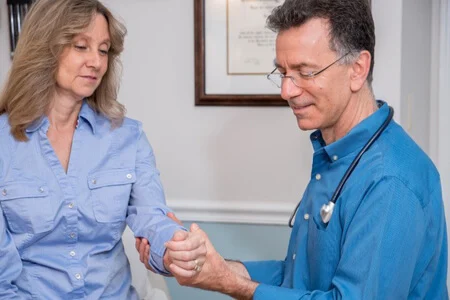 Dr. Rosenberg with a patient in the exam room.